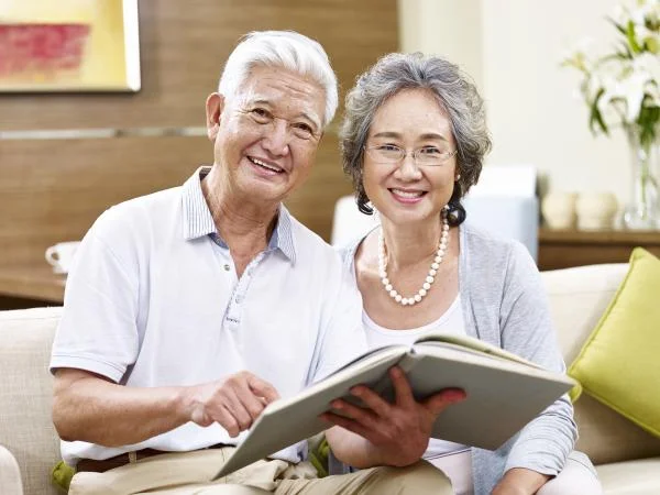 Library-supplied illustrative photograph of an older couple reading a book; not a photograph of this session.