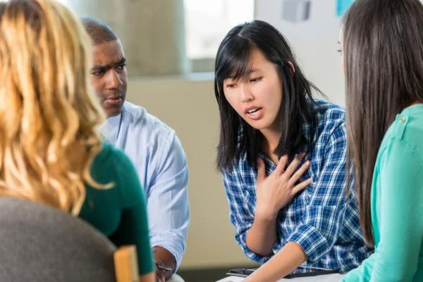 Library-supplied illustrative photograph of people talking; not a photograph of this reading-club session.