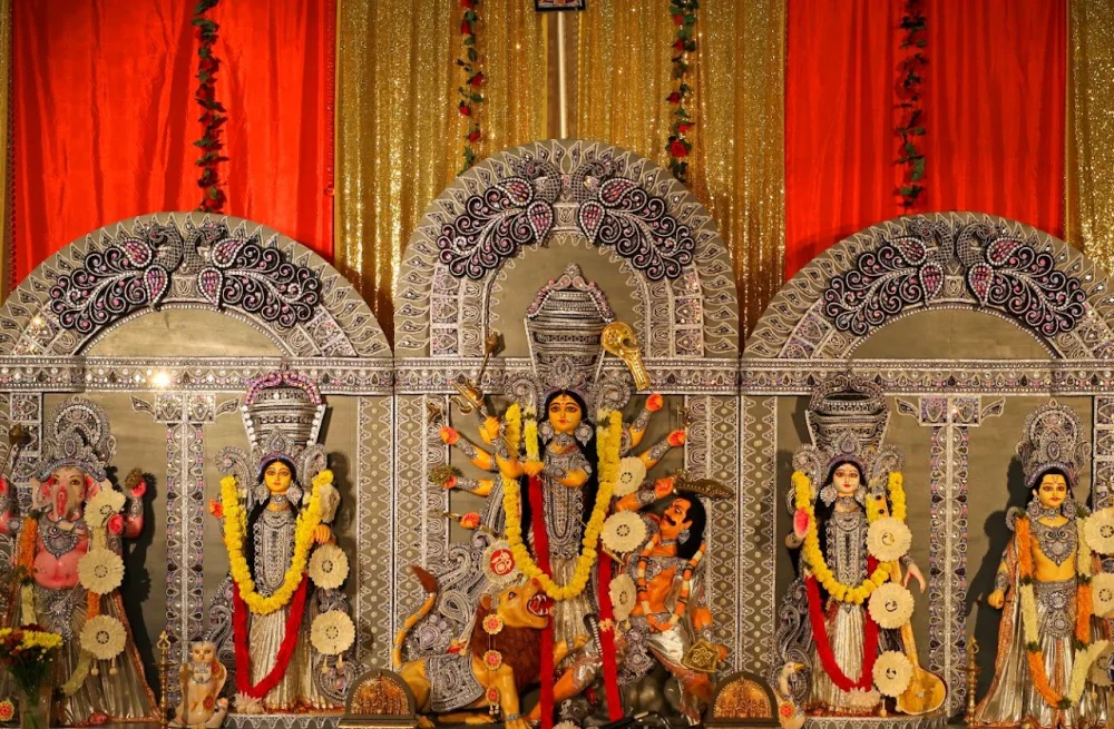 Durga Puja devotional display photographed for the DFW Kalakars website.