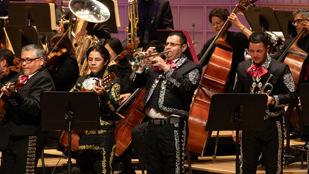 Mariachi musicians performing with the orchestra in the DSO’s official concert image.