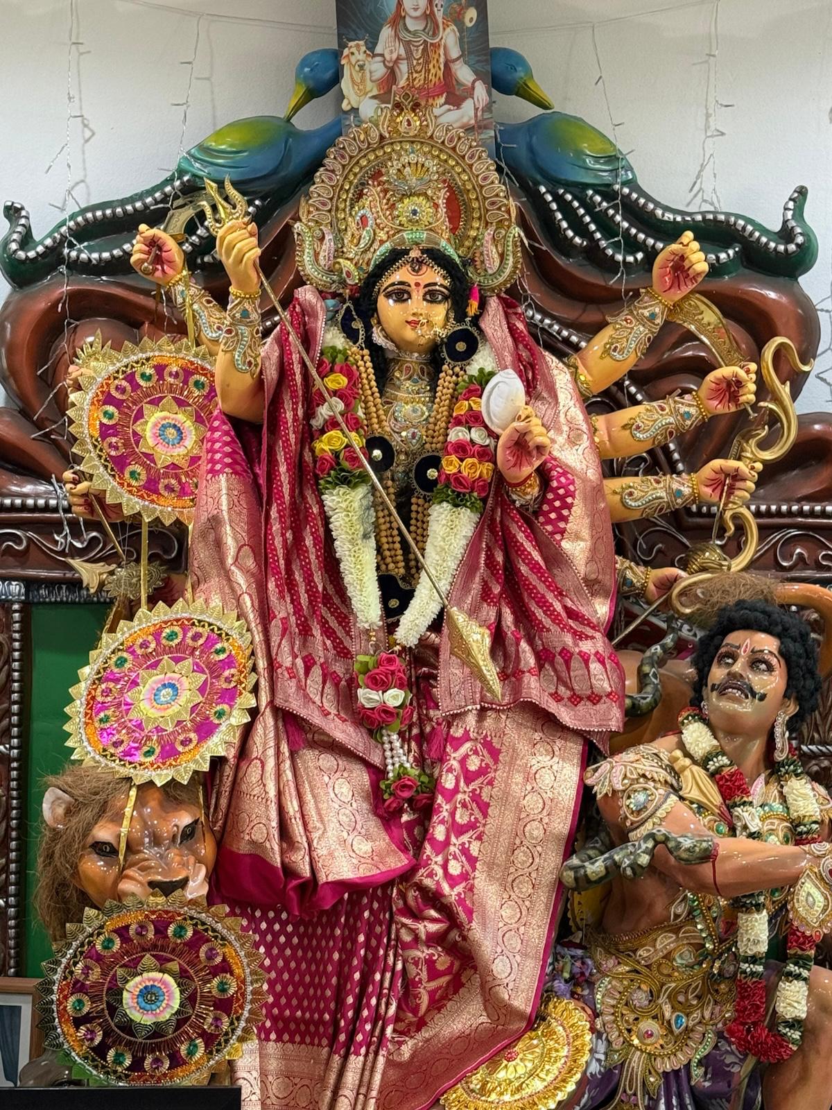 Official temple photograph of Maa Durga from SDKKM’s 2026 program page; not a photograph of the October 10 event.