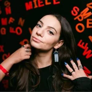 Official promotional artwork for Liz Miele's headlining show at The Riot Comedy Club.